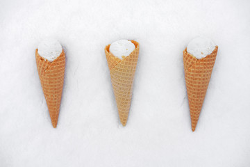 ice cream in waffle cone in snow