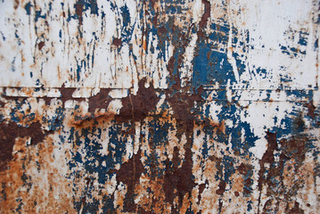 Background iron rusty artistic wall peeling paint.Grunge texture.Very graphic and edgy spray  on metal abstract .