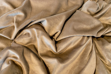 Beige blanket with random deeps folds