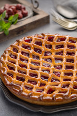 Homemade open sour cherry pie, delicious sweet dessert
