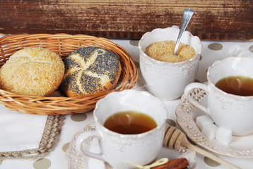 hot tea with fresh crunchy balls in retro cupcakes and a dotted basket