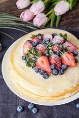 Crepes cake with cottage cheese and strawberry, selective focus