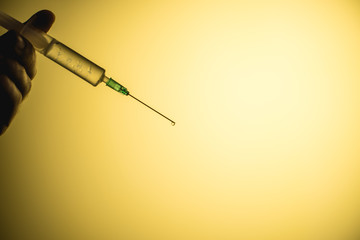 epidemic syringe on a yellow background