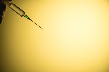 epidemic syringe on a yellow background