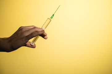 epidemic syringe on a yellow background