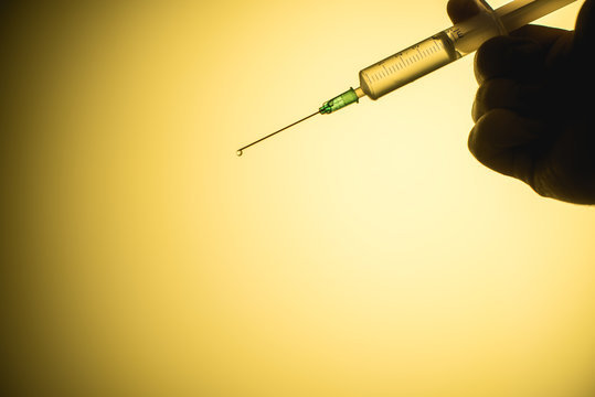 epidemic syringe on a yellow background