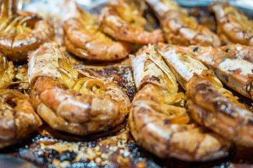 BBQ shrimps above tin foil