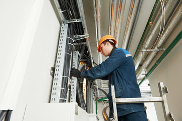two electrician workers at cabling