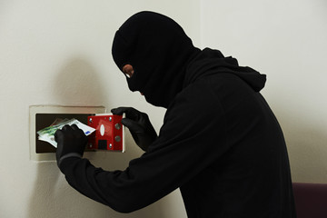 Thief in mask during safe codebreaking