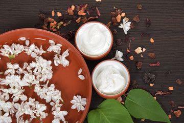 natural face cream from jasmin and lilac for wrinkles in plastic containers with elder flowers