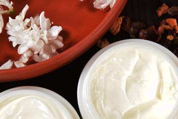 natural face cream from jasmin and lilac for wrinkles in plastic containers with elder flowers