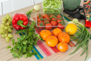 fresh vegetables straight from the market unpacked in the kitchen.
