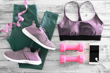 Womens active clothes (leggings, bra) footwear (sneakers) and  equipment (pink dumbbells, tape...