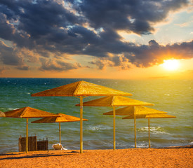sandy sea beach at the sunset