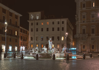 Fototapeta na wymiar Rome, Piazza Navona, view of the fountains at night (Fontana del Moro)