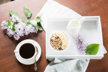 Healthy breakfast. Cup of black coffee, homemade oatmeal granola and nuts. Top view.
