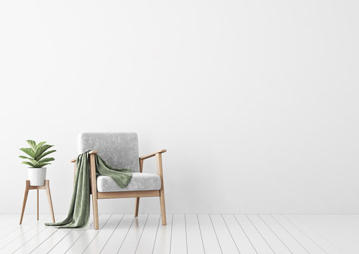 Living room interior with gray velvet sofa, pillows, green plaid, lamp and fiddle leaf tree in wicker basket on white wall background. 3D rendering.