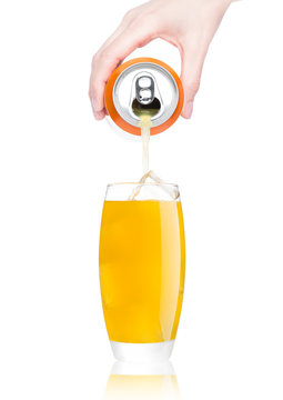 Female hand pouring orange soda from can to glass