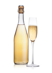 Bottle and glass of yellow champagne with bubbles