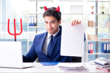 Devil angry businessman in the office