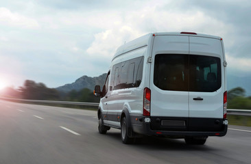 minibus speeding on highway in mountains - obrazy, fototapety, plakaty