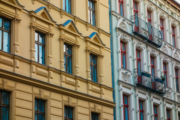 yellow and white facade of residential buildings