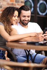 Beautiful couple having coffee on a date,having fun together.