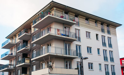 white apartment building with grey brick details