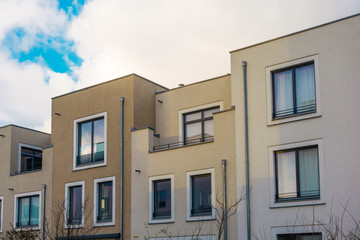 white and brown townhouses in a row