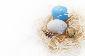 Still life of eggs, Easter eggs on the dry grass