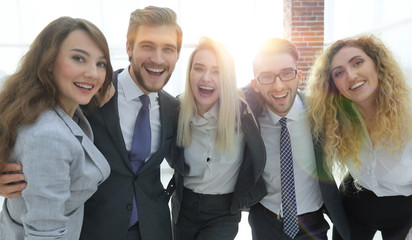 closeup.happy business team looking at camera