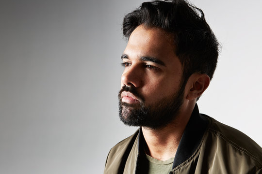 Portrait Of A Handsome Fashion Man Smiling While Looking Away From The Camera.