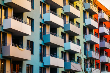 colorful apartment building with block formed balcony - obrazy, fototapety, plakaty