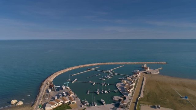 16649_The_aerial_view_of_the_long_sandbar_in_the_sea_in_Rodi_Italy.mov