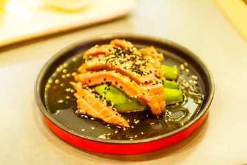 Grilled Ventresca tuna is cut into pieces