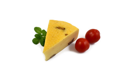 Cheese with garnish stock images. Piece of cheese with tomatoes and basil. Cheese isolated on a white background. Healthy snack images