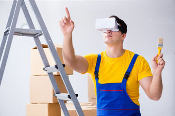 Painter contractor working with virtual reality goggles