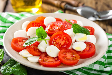 Tomato salad with mozzarella cheese and olive oil