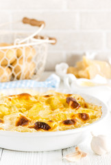 Baked potato gratin with garlic, cream and parmesan cheese