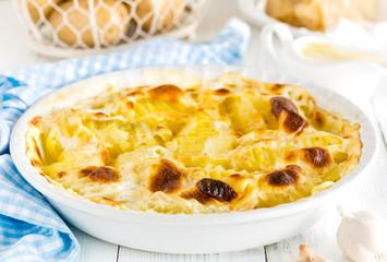 Baked potato gratin with garlic, cream and parmesan cheese