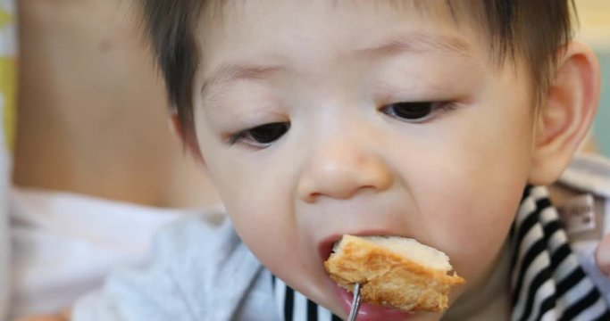 mother play pretend feeding toast with son