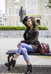 young brunette lady posing on the streets