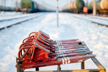 railway brake shoes of red color lie on the rack. railway skid. railway station. train shoe....