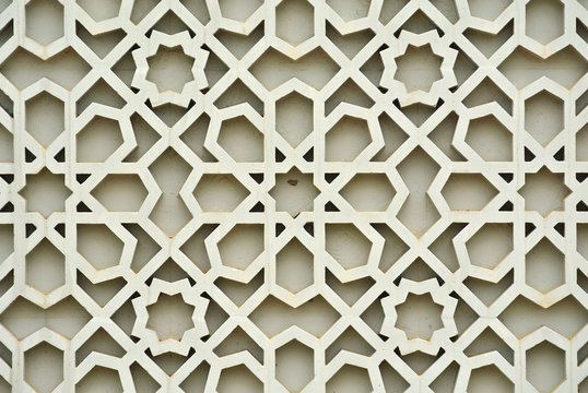 Islamic Geometry Pattern Made From Ground Fibre Reinforcement Concrete Used As Building Facade Wall Decoration. 