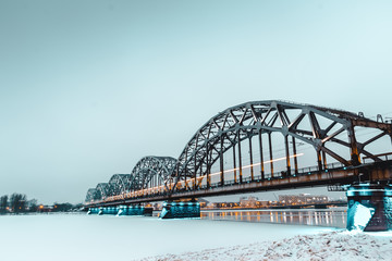 main bridgein Riga connecting the two sides of the city. Long exposure shot during the golden hour after sunrise
