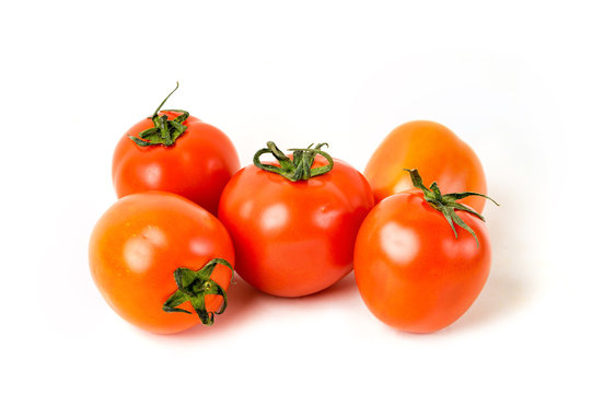 Red organic tomatoes on white isolated background