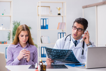 Doctor examining x-ray images of patient