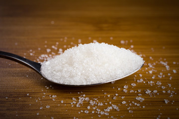 sugar pile spoon bamboo table. copy space, close up, selective focus