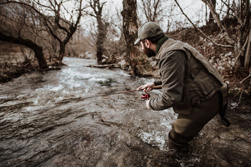 trout fisherman in the creek