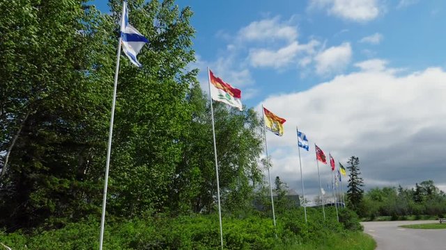 Slow motion shot of flags in the wind on poles